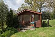 The summer-house is a real sun trap and the perfect spot for a barbecue.