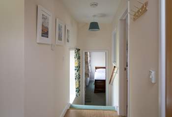 Four steep steps lead down to Bedroom 2, the utility-room is to the right of the photograph.