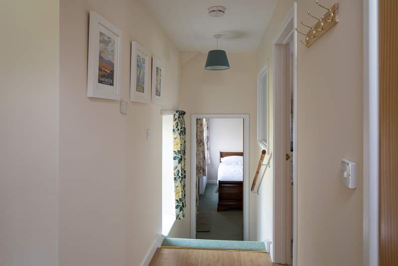 Four steep steps lead down to Bedroom 2, the utility-room is to the right of the photograph.