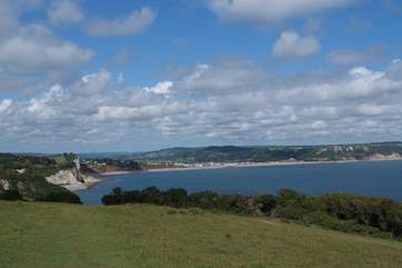 This is a view of the Jurassic Coast from the coastal path above the fishing village of Beer, with Seaton in the distance.