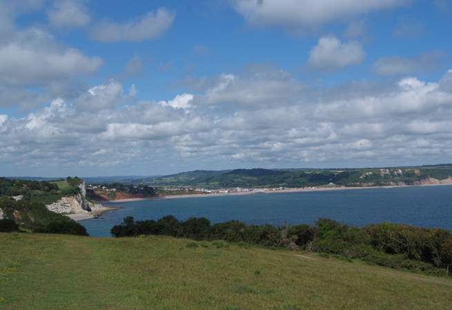 This is a view of the Jurassic Coast from the coastal path above the fishing village of Beer, with Seaton in the distance.
