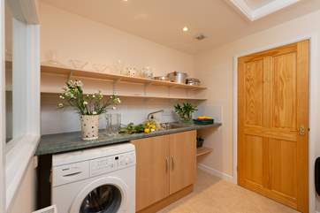 There is a large separate utility-room with a further cloakroom.