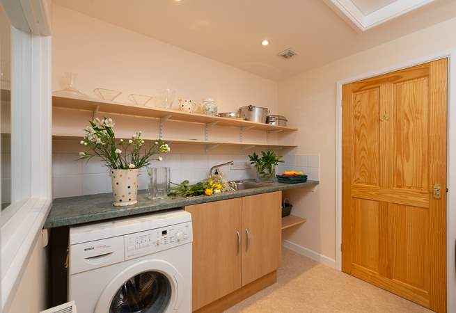 There is a large separate utility-room with a further cloakroom.