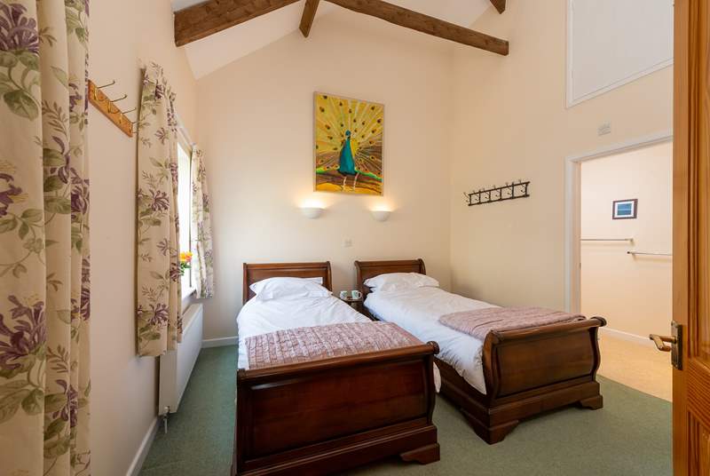 This is the twin bedroom with its lovely sleigh beds and en suite shower-room.