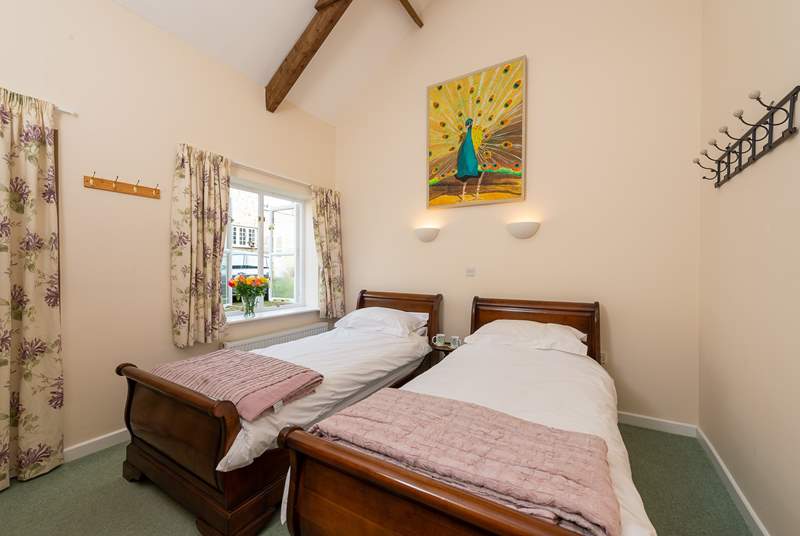 Another view of the twin bedroom. This room looks out into the original cobbled farmyard - the cottage makes up two sides of the courtyard and the farmhouse makes up another.