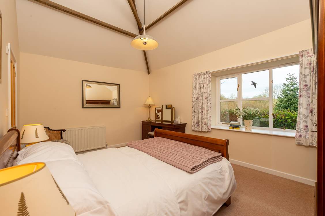 The master bedroom is another wonderfully sized room, over looking the garden. Now with a new bed.