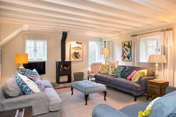 The main sitting-room has a wonderful wood-burner making it the ideal retreat all year round.
