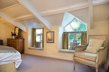 Bedroom 4 is furnished with gorgeous fabrics. Please mind your head on the sloping ceilings.