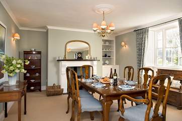 The elegant dining-room complete with wood-burning stove.