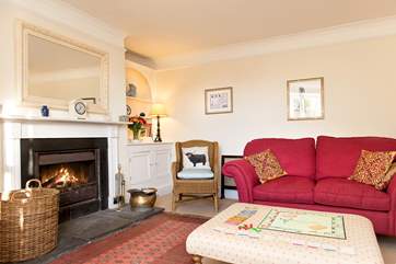 The sitting-room has an open fire, a welcome sight on chillier evenings.