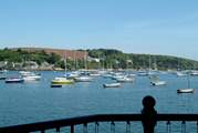 Watch the yachts on their moorings from the balcony.