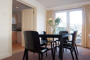 Double doors lead into the kitchen.