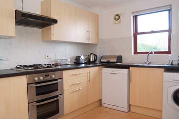 The kitchen looks out towards the Royal Cornwall Yacht Club.