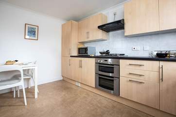 The kitchen is well-equipped and has a breakfast table too.