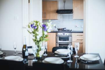 Double doors open from the living space to the kitchen.