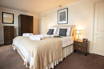 The master bedroom has a king-size bed and an en suite shower-room.
