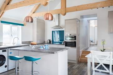 From the kitchen-area, there are three steps up into the shower-room and bedroom.