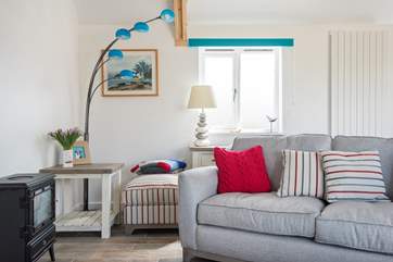 Sit on the sofa and look out into the garden and over the fields.