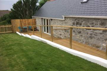 The private garden and terrace is a sunny spot with countryside views.