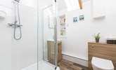 The en suite shower-room is next to the bedroom, three steps up from the living space. - Thumbnail Image