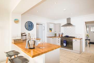 The stunning kitchen/dining-room is a fabulous place for cooking and entertaining whatever the weather is like outside.