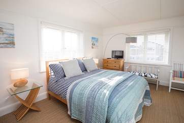 The beautiful master bedroom with king-size bed.