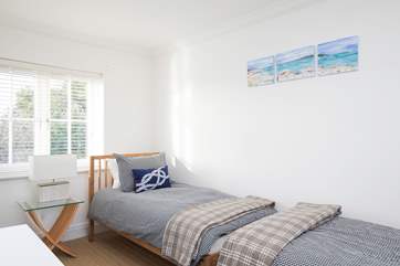 The twin bedroom is on the first floor and has its own en suite shower-room.