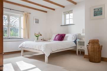 The master bedroom where the morning sun shines through.