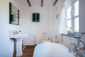 The master en suite bathroom with roll-top bath.