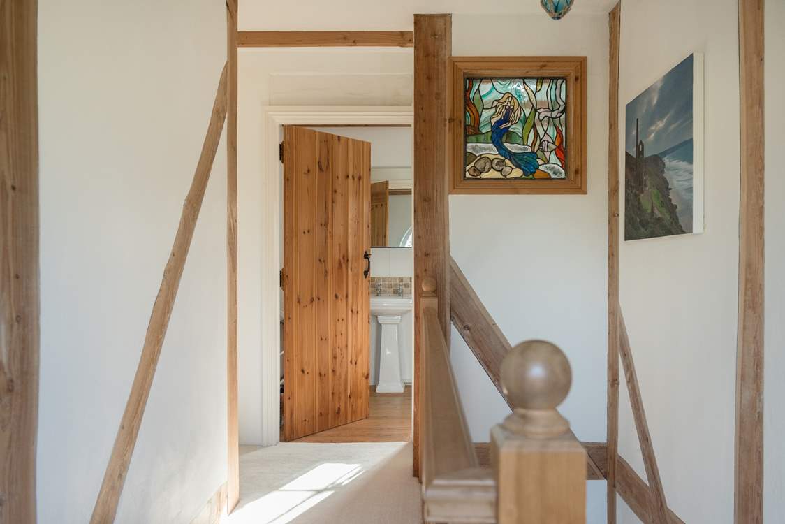 The landing leading to two futher bedrooms and second bathroom.