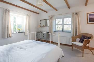 The bedroom has stunning dual-aspect views.