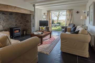 The sitting-room has patio doors opening into the private garden.