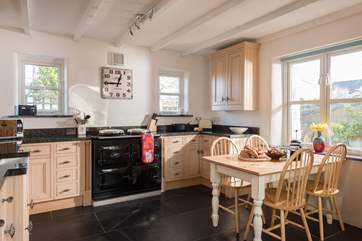 The AGA is a lovely feature and ever so cosy in the winter - you might need to open a window in the summer if you feel the heat.