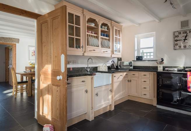 The kitchen is well-equipped and joins the dining-room. There is a four ring electric hob and combi-microwave oven if you are a little cautious of the AGA. 