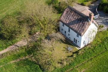 A birds eye view of the cottage, garden and parking. What a tranquil spot.