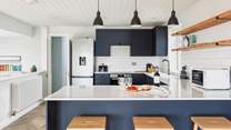 The well-equipped kitchen offers plenty of space to whip up a feast.