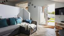 The living-room opens out onto the paved patio area. This fantastic layout allows everyone to enjoy this lovely property and fabulous location to the full.