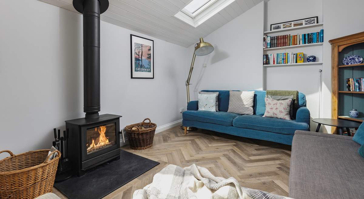 The living-area has a fabulous wood-burner, which sets the perfect scene for cuddling up and enjoying a cosy night in.