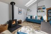 The living-area has a fabulous wood-burner, which sets the perfect scene for cuddling up and enjoying a cosy night in.
