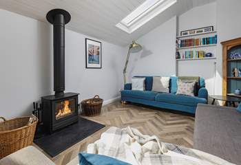 The living-area has a fabulous wood-burner, which sets the perfect scene for cuddling up and enjoying a cosy night in.