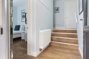 Please take care as these stairs lead up to the higher level of the house and are narrower than standard.