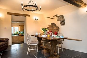 Steps from the kitchen lead up to the dining-area.
