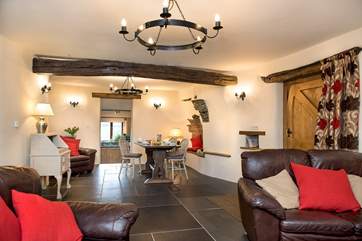 The spacious open plan sitting/dining-room has some wonderful features.