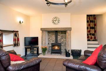Cosy up in front of the wood-burning stove - a welcome sight on those out-of-season breaks.