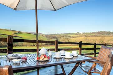 Treat yourself to a cream tea on the terrace - with that view who can blame you!