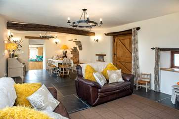 The spacious open plan sitting/dining-room has some wonderful features.