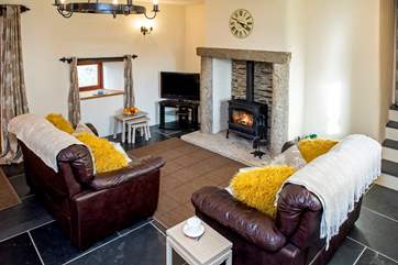 Cosy up in front of the wood-burning stove - a welcome sight on those out-of-season breaks.