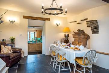 Steps from the kitchen lead up to the dining-area.