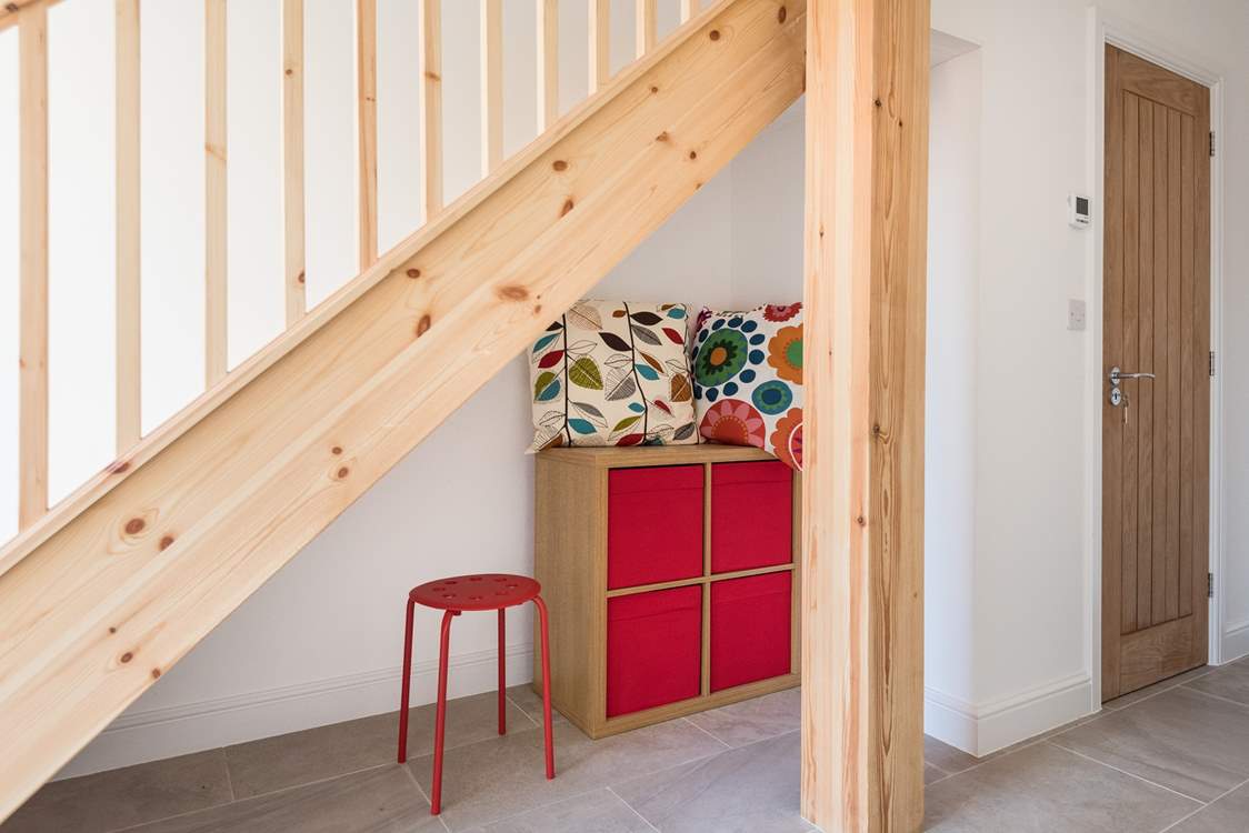 Under the stairs is a little play area perfect for the toddlers.