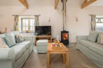 When the weather is not so good sit around the cosy wood-burner and enjoy the glow, however, the under-floor heating will also keep you warm.